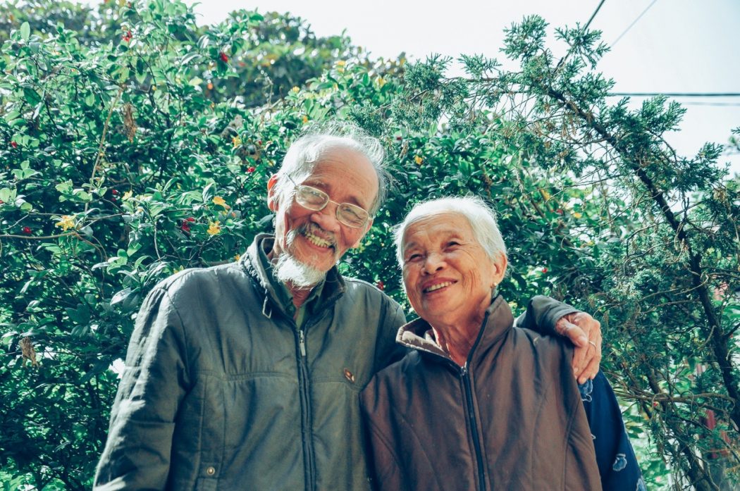 smiling-man-and-woman-wearing-jackets-1642883